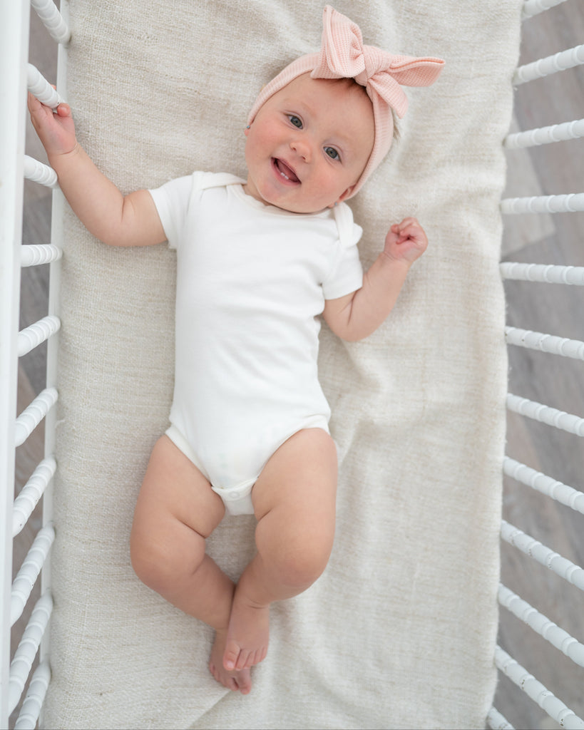 Organic cotton baby short sleeve bodysuit in Angel White